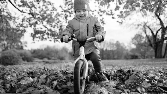 Child learning to ride bike.