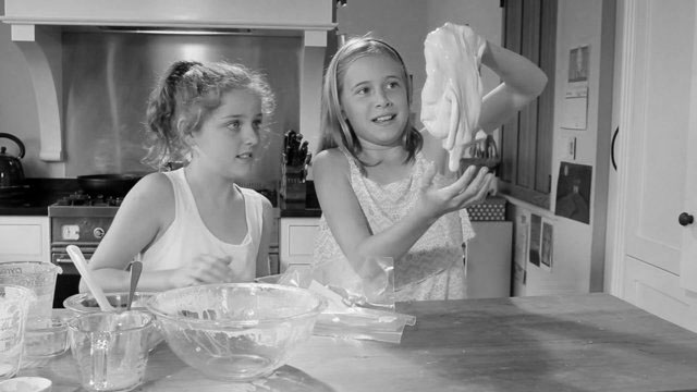 Young girls making slime.
